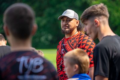 Coach speaking to academy players